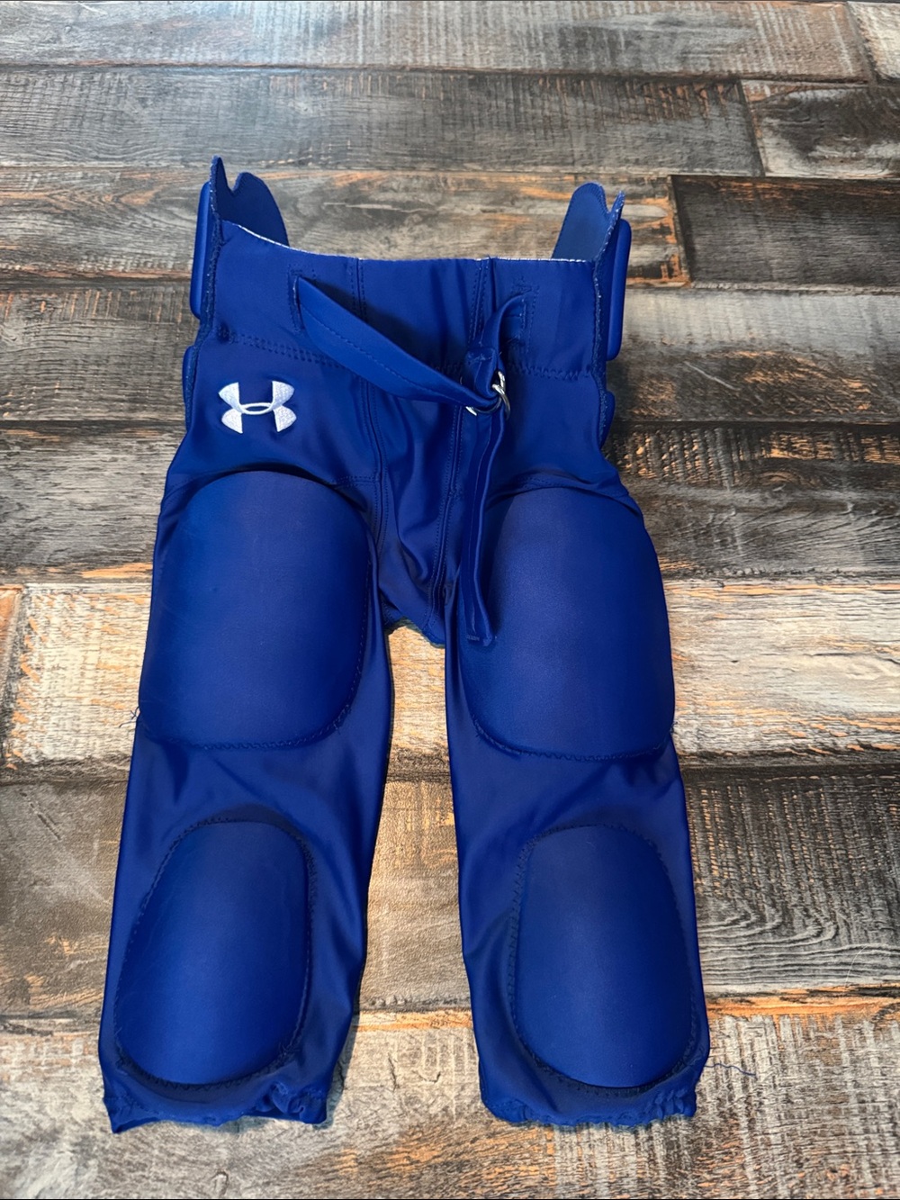 Under Armour youth size medium blue football padded pants